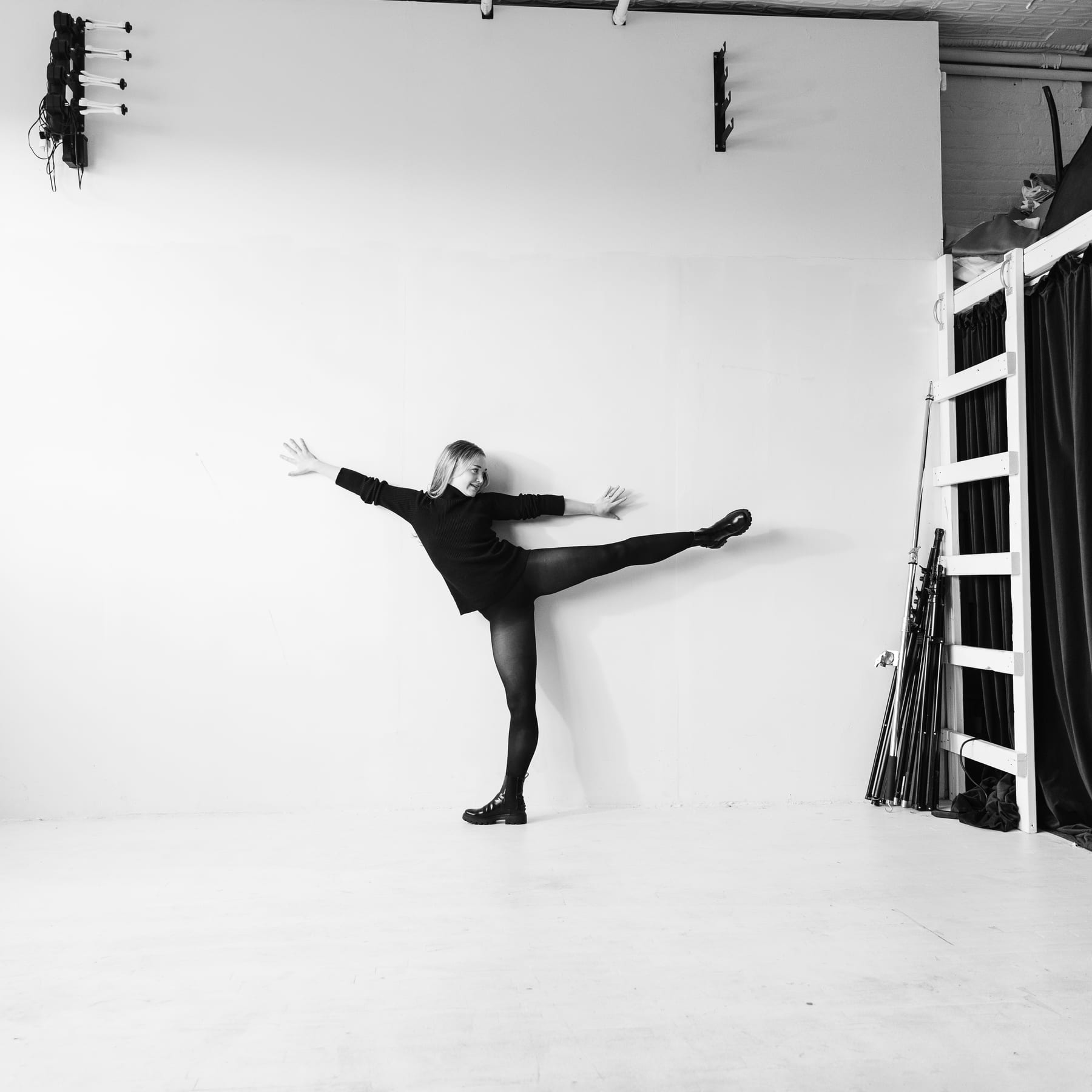 Crawford against a wall, black and white